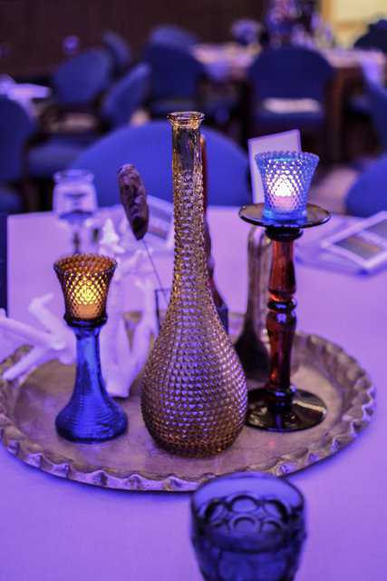 Corporate party colorful candlelit center pieces provided by Relics Rentals at the Haggerty Museum of Art in Milwaukee, WI.