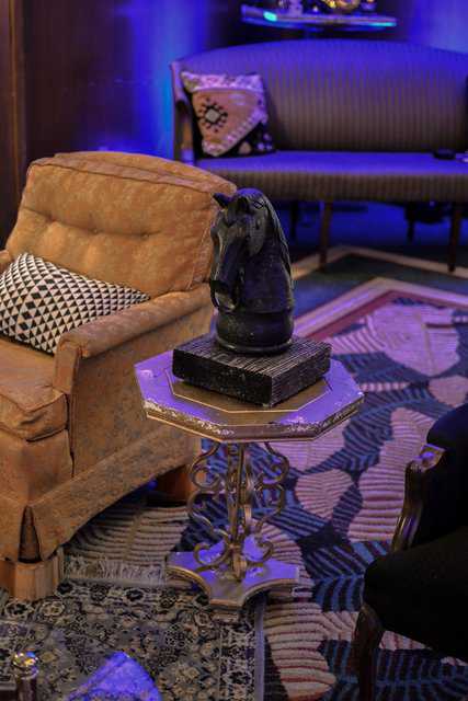Black horse head statue provided by Relics Rentals for equestrian themed party vibe.